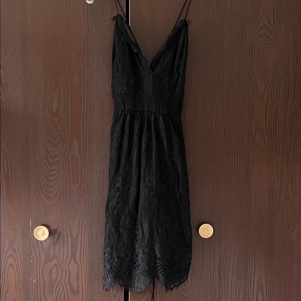 Aooksmery black thinly strapped black dressy dress. Lace up tie. Size Small. NWT